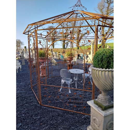 282 - Decorative wrought iron garden Gazebo with ivy leaf decoration. {320 cm H x 360 cm Diam}.