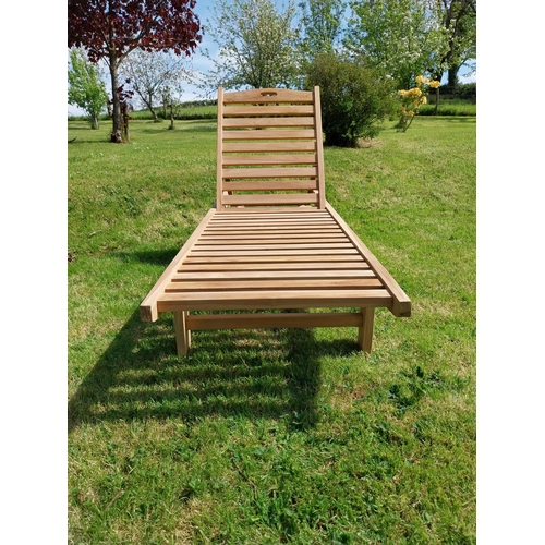 318 - Good quality teak sun lounger {92 cm H x 65 cm W x 200 cm L}.