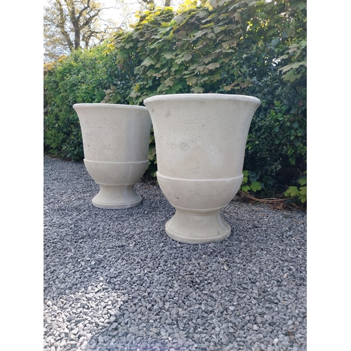 334 - Pair of moulded sandstone circular urns {74 cm H x 59 cm Dia.}.