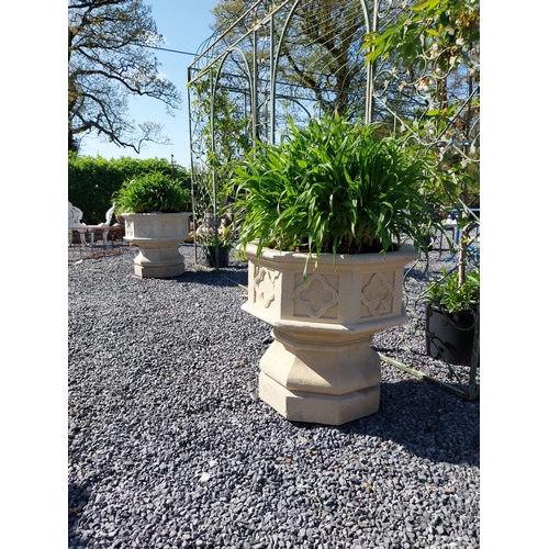 352 - Pair of moulded sandstone octagon urns in the Gothic style {69 cm H x 67 cm W x 67 cm D}.