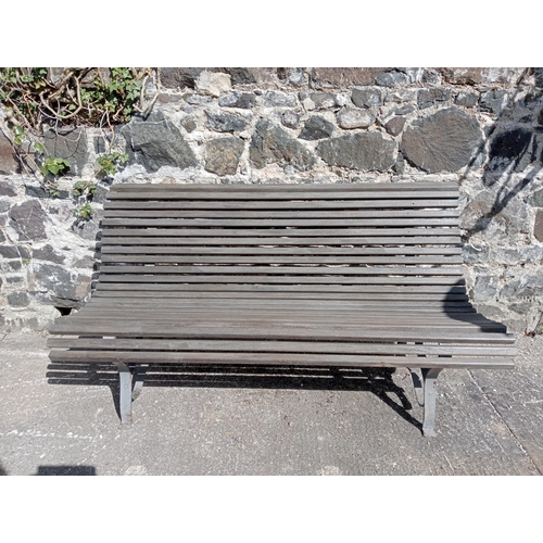 357 - Wrought iron and  wooden rolltop garden bench {H 80cm x D 72cm x W }.