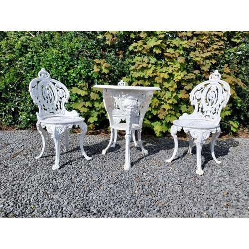 36 - 19th C. cast iron garden table with three matching chairs {Tbl. 68 cm H x 59 cm Dia. and Chairs 83 c... 