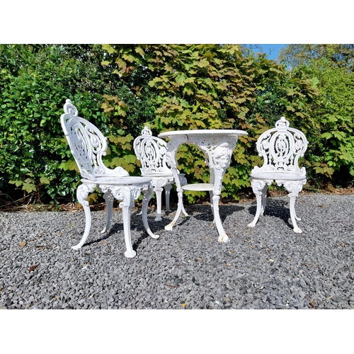 36 - 19th C. cast iron garden table with three matching chairs {Tbl. 68 cm H x 59 cm Dia. and Chairs 83 c... 