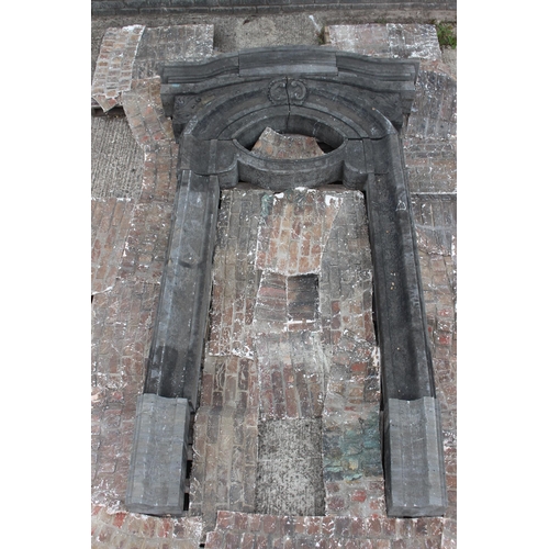 377 - 19th C. Kilkenny stone door frame with arched top enclosing an oval window {H 360cm x W 212cm x D 25... 