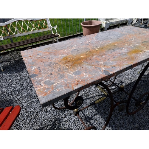 380 - Good quality wrought iron and brass butchers table with marble top {76 cm H x 120 cm W x 60 cm D}.