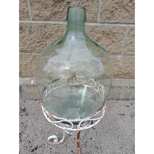 407 - Glass carboy raised on metal stand {H 90cm x Dia 35cm }. (NOT AVAILABLE TO VIEW IN PERSON)