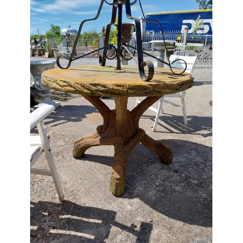 410 - Moulded stone garden table in the form of tree branches {80 cm H x 112 cm Dia.}.