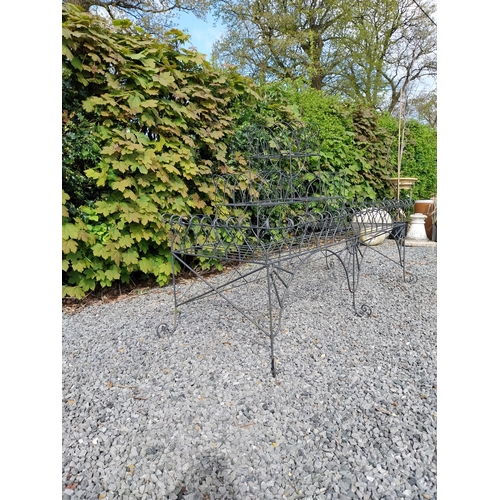 412 - Wrought iron wired three-tiered waterfall plant stand {105 cm H x 168 cm W x 67 cm D}.