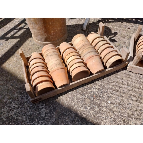 426 - Collection of approximately one hundred and five early 20th C. terracotta plant pots in original sta... 