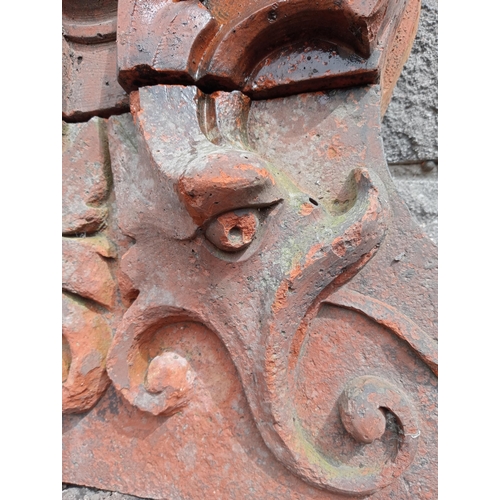 43 - Terracotta wall frieze with scroll design {H 62cm x W 48cm x D 21cm }.