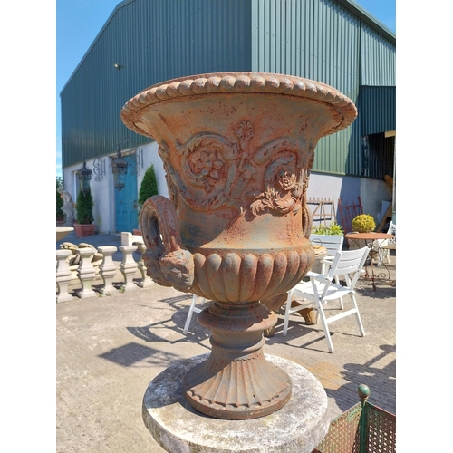 446 - Decorative French cast iron urn raised on moulded stone pedestal {144 cm H x 47 cm Dia.}.