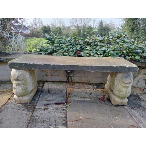 447 - Composition stone bench raised on pedestals in the form of Griffins {H 44cm x W 120cm x D 38cm }. (N... 