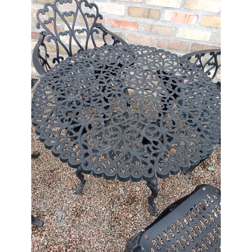 483 - Cast aluminium black  garden table four armchairs {Chairs H 80cm x W 58cm x D 50cm Table H 69cm  x D... 