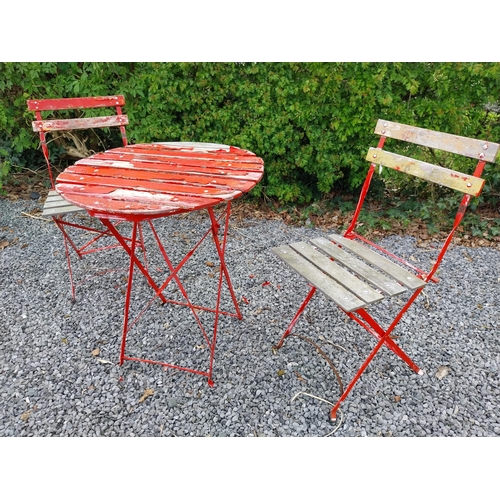 485 - Metal and wooden garden table with two matching chairs {Tbl. 71 cm H x 60 cm Dia. and 82 cm H x 38 c... 