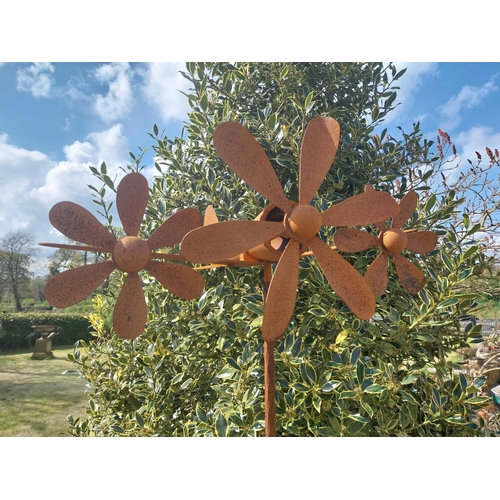 498 - Metal windmill in the form of a plane raised on stand {196 cm H x 63 cm W x 58 cm D}.