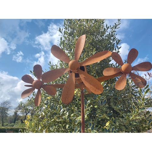 498 - Metal windmill in the form of a plane raised on stand {196 cm H x 63 cm W x 58 cm D}.