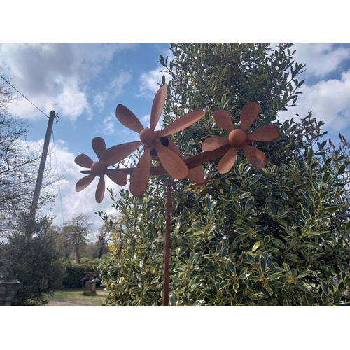 498 - Metal windmill in the form of a plane raised on stand {196 cm H x 63 cm W x 58 cm D}.