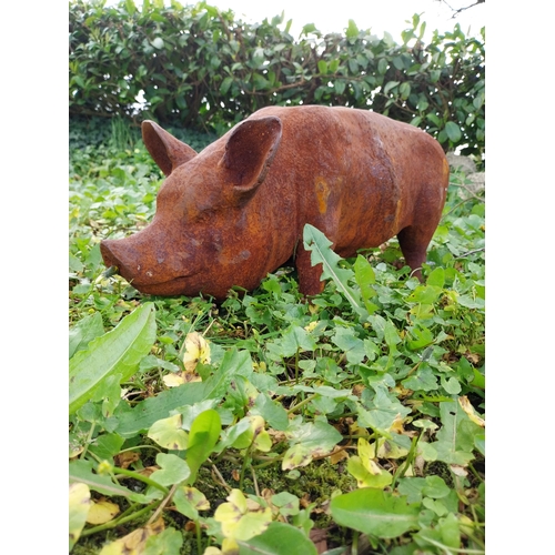 50 - Good quality cast iron statue of a Pig {29 cm H x 70 cm W x 20 cm D}.