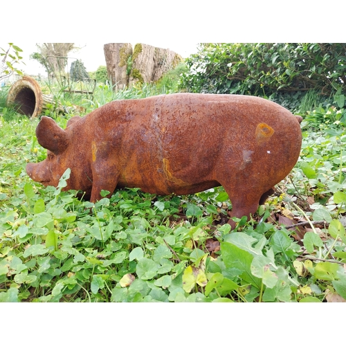 50 - Good quality cast iron statue of a Pig {29 cm H x 70 cm W x 20 cm D}.