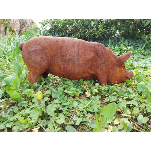 50 - Good quality cast iron statue of a Pig {29 cm H x 70 cm W x 20 cm D}.