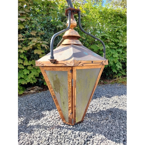 524 - Good quality copper wall lantern with wrought iron bracket {129 cm H x 94 cm W x 54 cm D}.