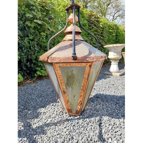 524 - Good quality copper wall lantern with wrought iron bracket {129 cm H x 94 cm W x 54 cm D}.