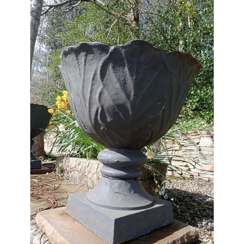 529 - Pair of cast iron urns raised on sandstone pedestal {H 67cm x Dia 60cm }. (NOT AVAILABLE TO VIEW IN ... 