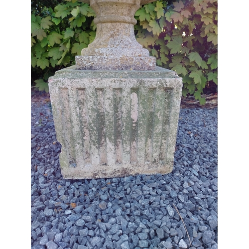 542 - Pair of early 20th C. composition urns on square pedestals {68 cm H x 46 cm Dia.}.