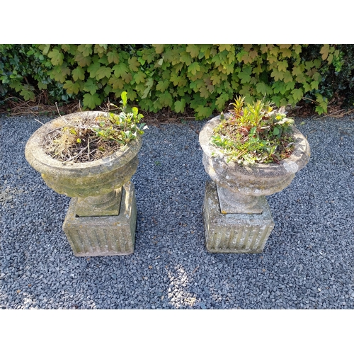 543 - Pair of early 20th C. composition urns on square pedestals {68 cm H x 46 cm Dia.}.