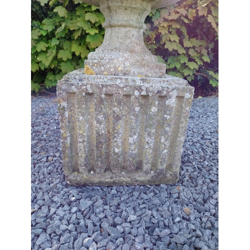 543 - Pair of early 20th C. composition urns on square pedestals {68 cm H x 46 cm Dia.}.