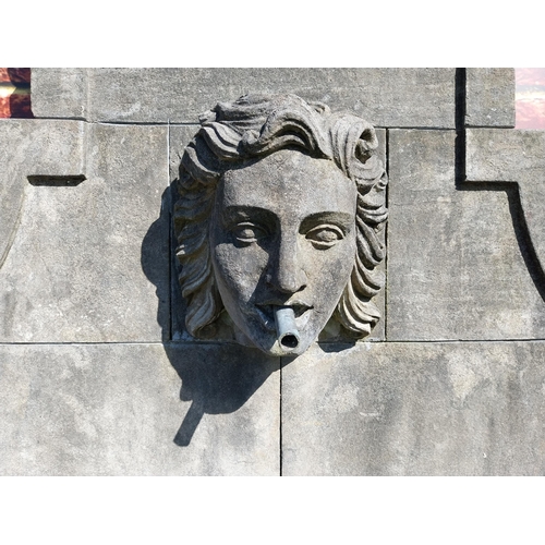 550 - Hand carved limestone wall fountain decorated with Ladies mask {172 cm H x 156 cm W x 127 cm D}.