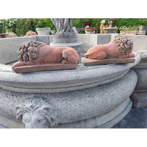 556 - Pair of moulded terracotta statuettes of recumbent Lions {14 cm H x 32 cm W x 11 cm D}.