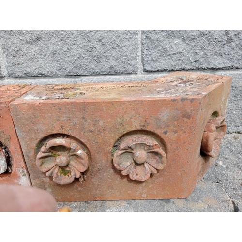 557 - Collection of five terracotta copings with floral design {H 24cm x W 186cm x D 26cm}. (NOT AVAILABLE... 