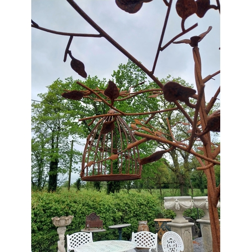 559 - Decorative wrought iron bird feeder in the form of a tree and two hanging bird cages {224 cm H x 135... 