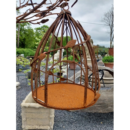 559 - Decorative wrought iron bird feeder in the form of a tree and two hanging bird cages {224 cm H x 135... 