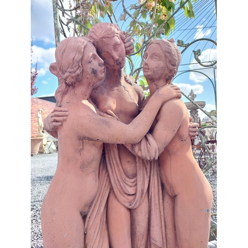 564 - Moulded terracotta Three Graces statue {106 cm H x 57 cm W x 29 cm D}.