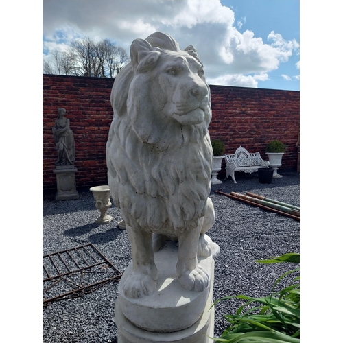 569 - Pair of good quality moulded stone statues of seated Lions raised on pedestals {185 cm H x 123 cm W ... 