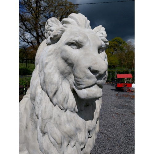 569 - Pair of good quality moulded stone statues of seated Lions raised on pedestals {185 cm H x 123 cm W ... 