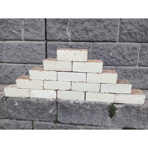 57 - Collection of one hundred white glazed bricks {H 8cm x W 23cm x D 11cm }.