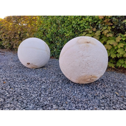 572 - Pair of moulded stone garden spheres {42 cm Dia.}.