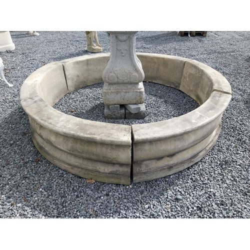 588 - Moulded stone flower bed surround {39 cm H x 200 cm Dia.}. Plus an urn decorated with swags and a gr... 