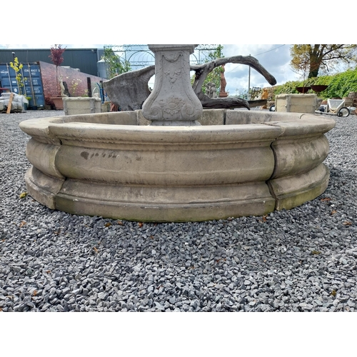 588 - Moulded stone flower bed surround {39 cm H x 200 cm Dia.}. Plus an urn decorated with swags and a gr... 