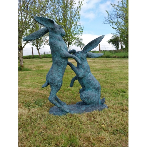 600 - Exceptional quality bronze sculpture of Hares at play {76cm H x 75cm W x 33cm D}