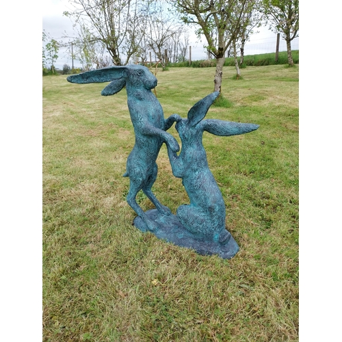 600 - Exceptional quality bronze sculpture of Hares at play {76cm H x 75cm W x 33cm D}