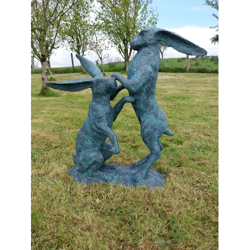 600 - Exceptional quality bronze sculpture of Hares at play {76cm H x 75cm W x 33cm D}