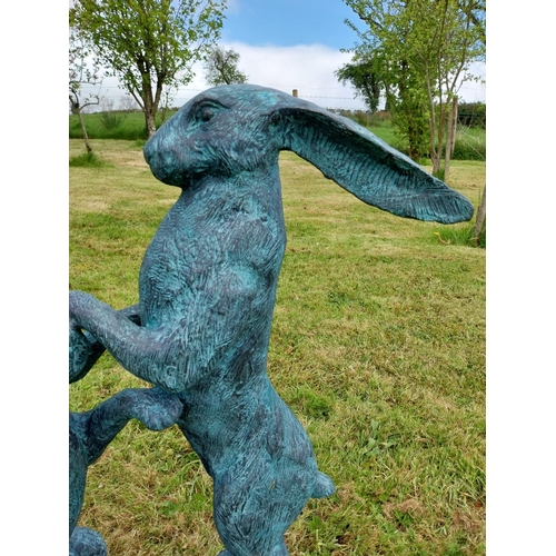 600 - Exceptional quality bronze sculpture of Hares at play {76cm H x 75cm W x 33cm D}