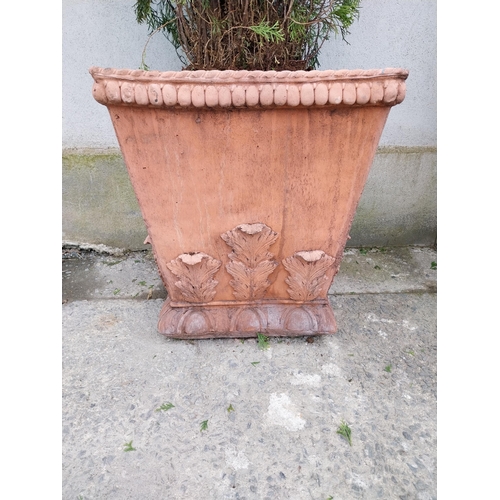 621 - Pair of moulded terracotta urns decorated with acanthus leaf {62 cm H x 58 cm W x 58 cm D}.