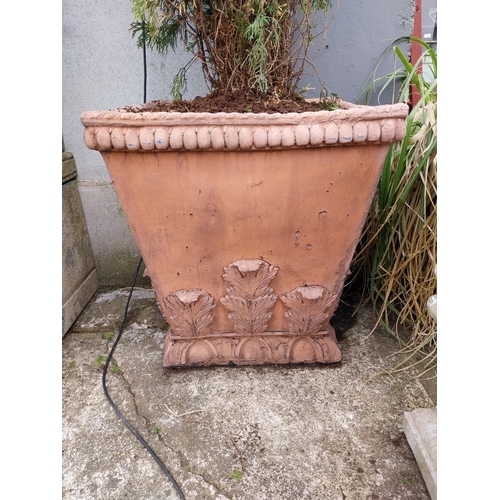 621 - Pair of moulded terracotta urns decorated with acanthus leaf {62 cm H x 58 cm W x 58 cm D}.