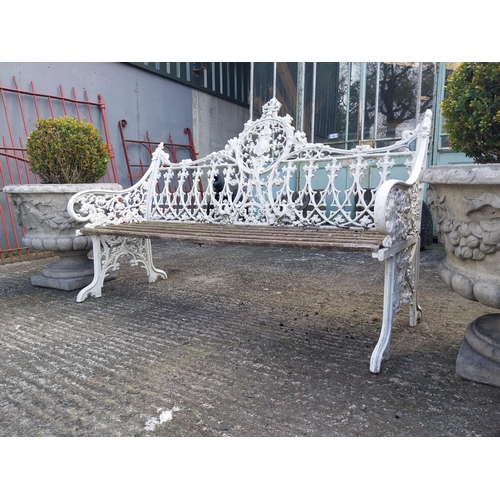 630 - Decorative cast alloy garden bench in the Victorian style {99 cm H x 150 cm W x 68 cm D}.