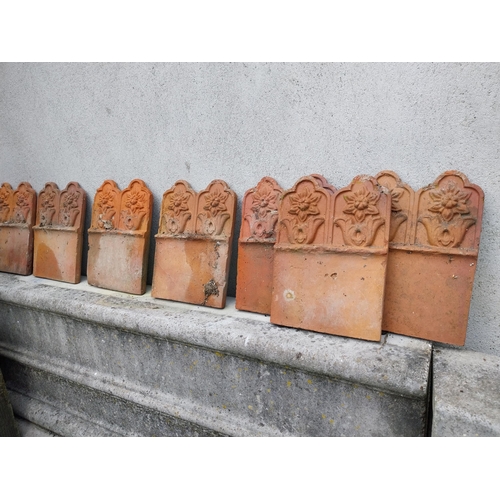 634 - Collection of seventeen early 20th C. terracotta edging tiles {25 cm H x 18 cm W each}.